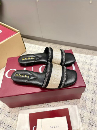 ua G*u*i women's slide sandal with web