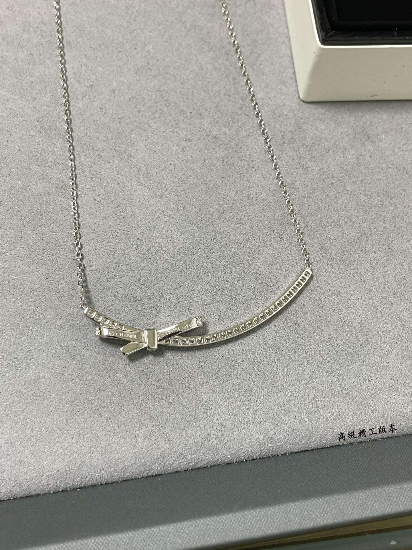 Ch*el bow tie necklace