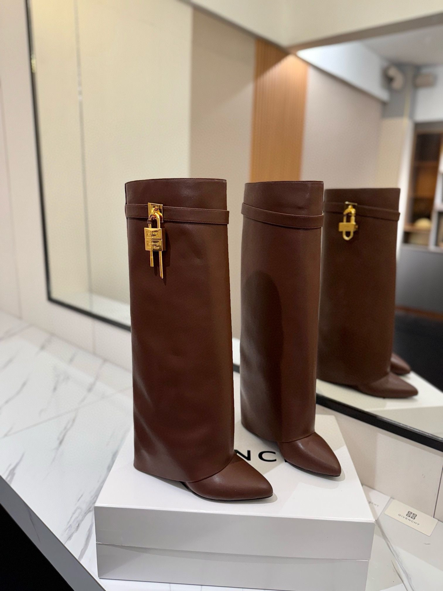 ua G1uenchy shark lock boots in leather