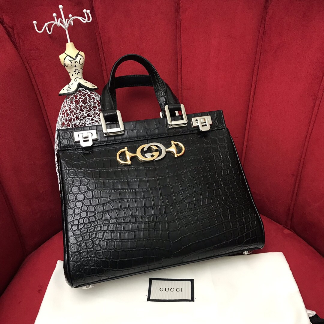 G*u*i zumi leather medium top handle bag