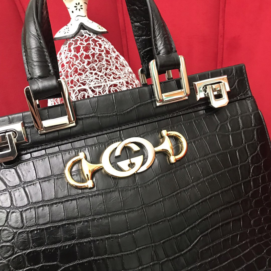 G*u*i zumi leather medium top handle bag