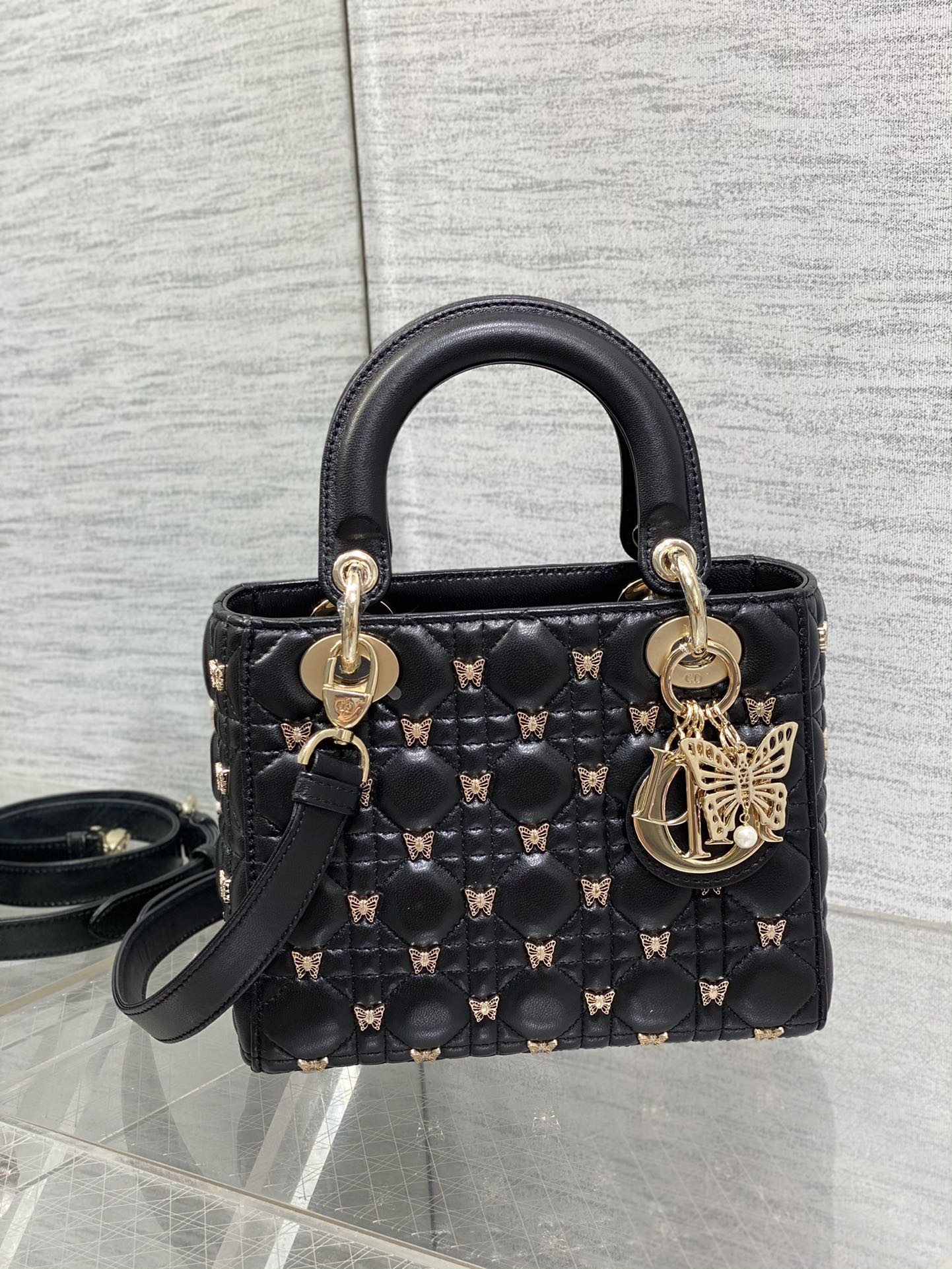 small lady D*or black with butterfly studs