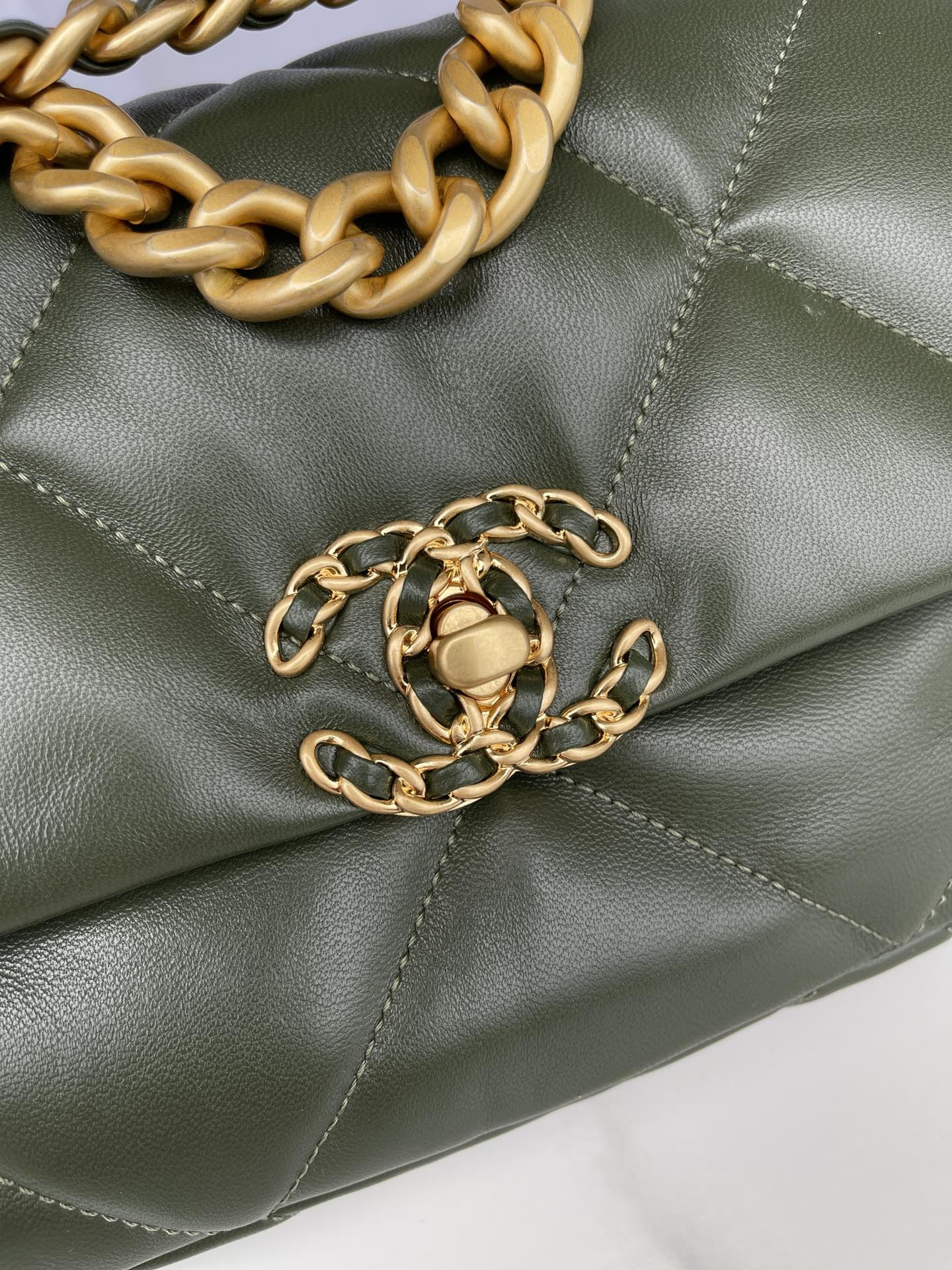 Ch*el 19 handbag shiny leather, gold-tone, silver-tone & ruthenium-finish metal dark green 6.2 × 10.1 × 3.5 in