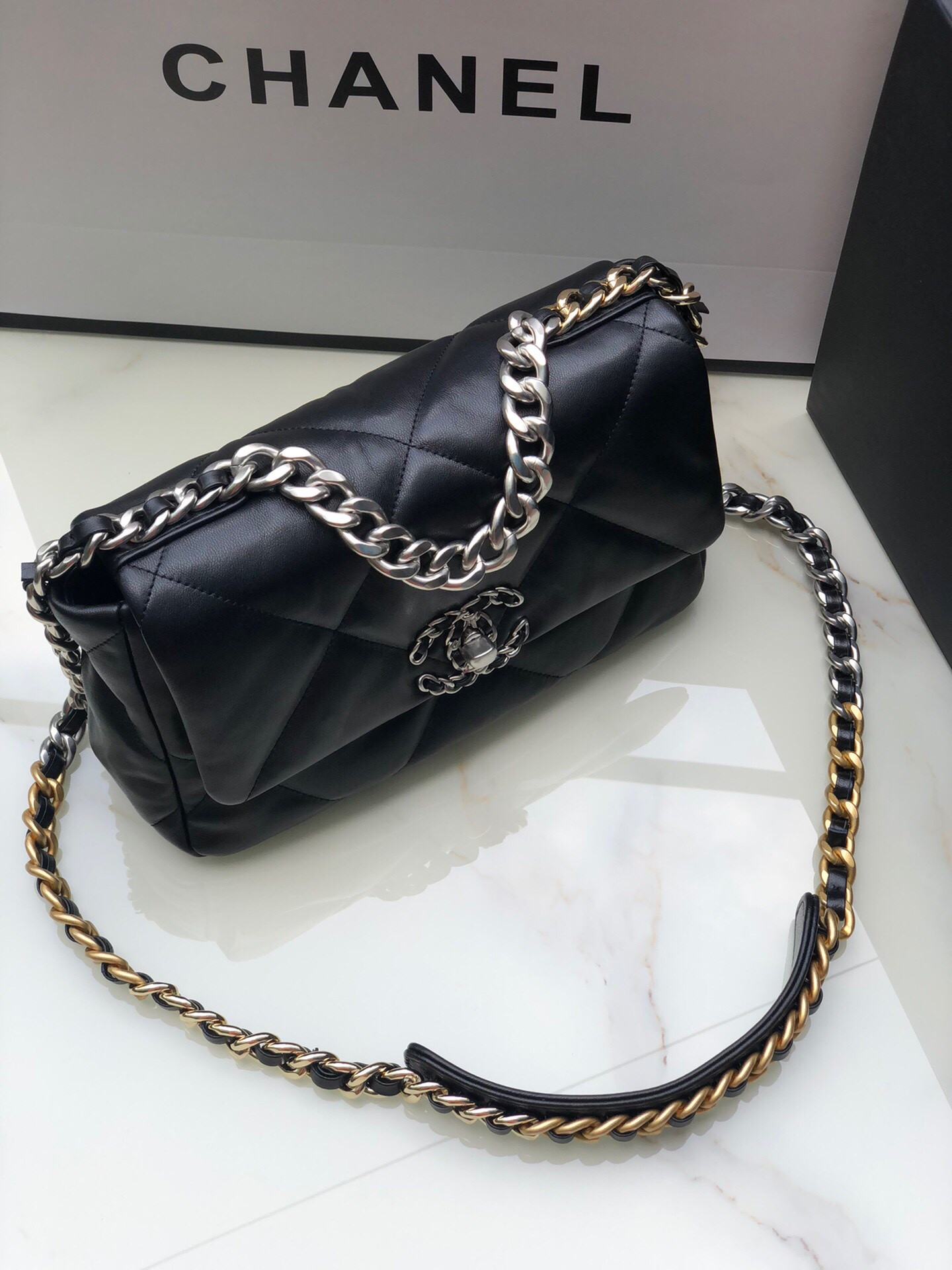 Ch*el 19 handbag shiny leather, gold-tone, silver-tone & ruthenium-finish metal black 6.2 × 10.1 × 3.5 in