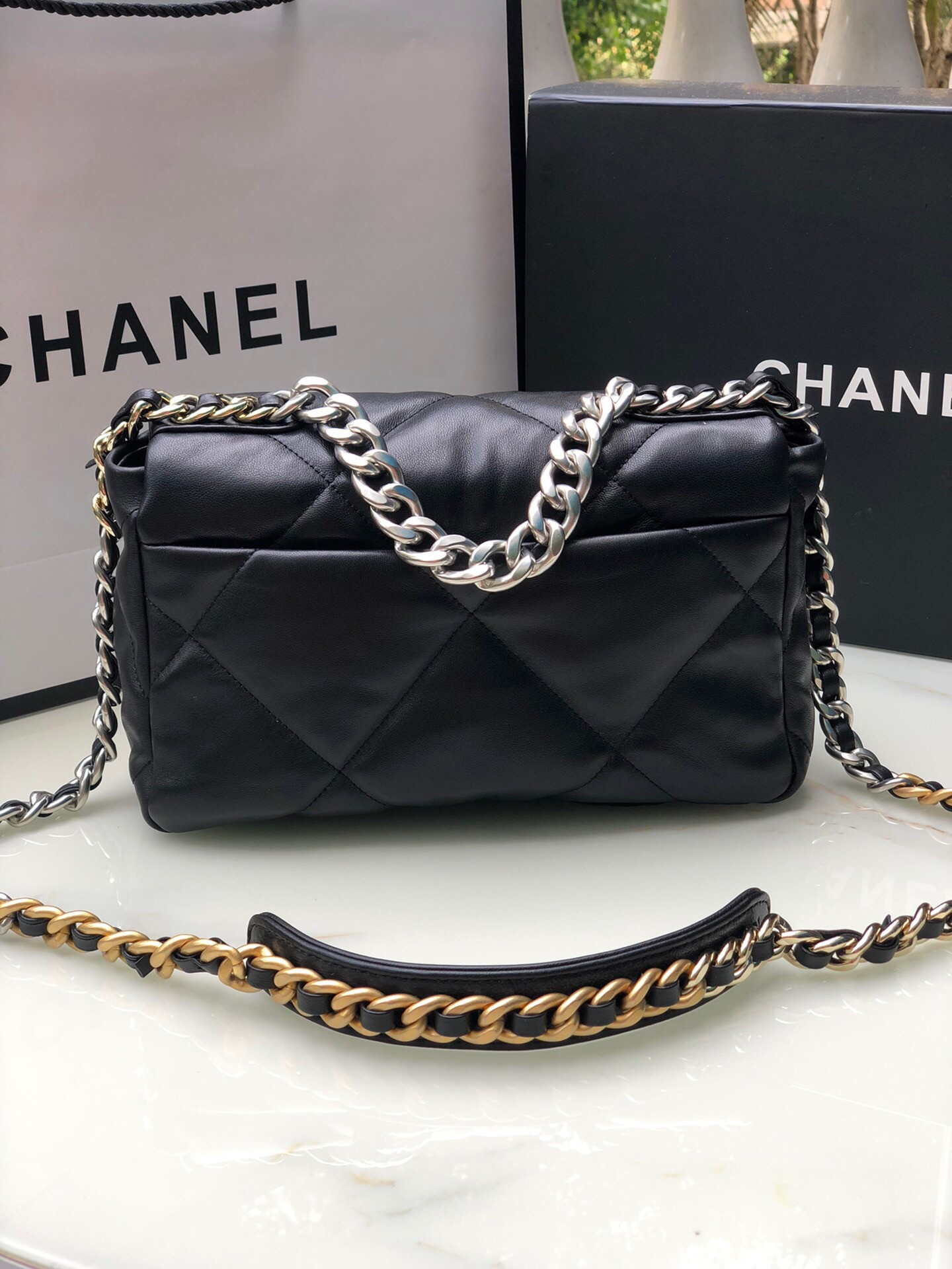 Ch*el 19 handbag shiny leather, gold-tone, silver-tone & ruthenium-finish metal black 6.2 × 10.1 × 3.5 in