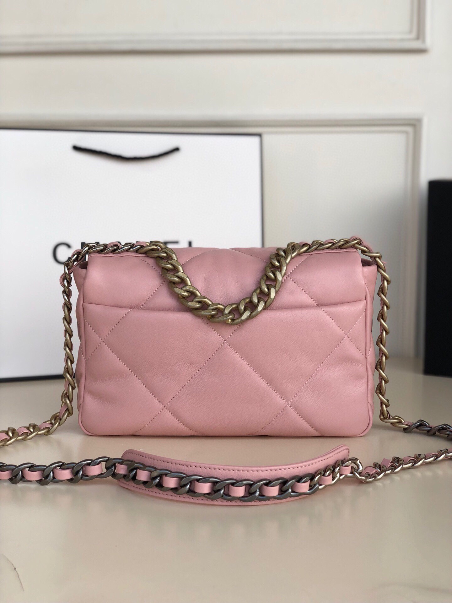 Ch*el 19 handbag shiny leather, gold-tone, silver-tone & ruthenium-finish metal light pink 6.2 × 10.1 × 3.5 in