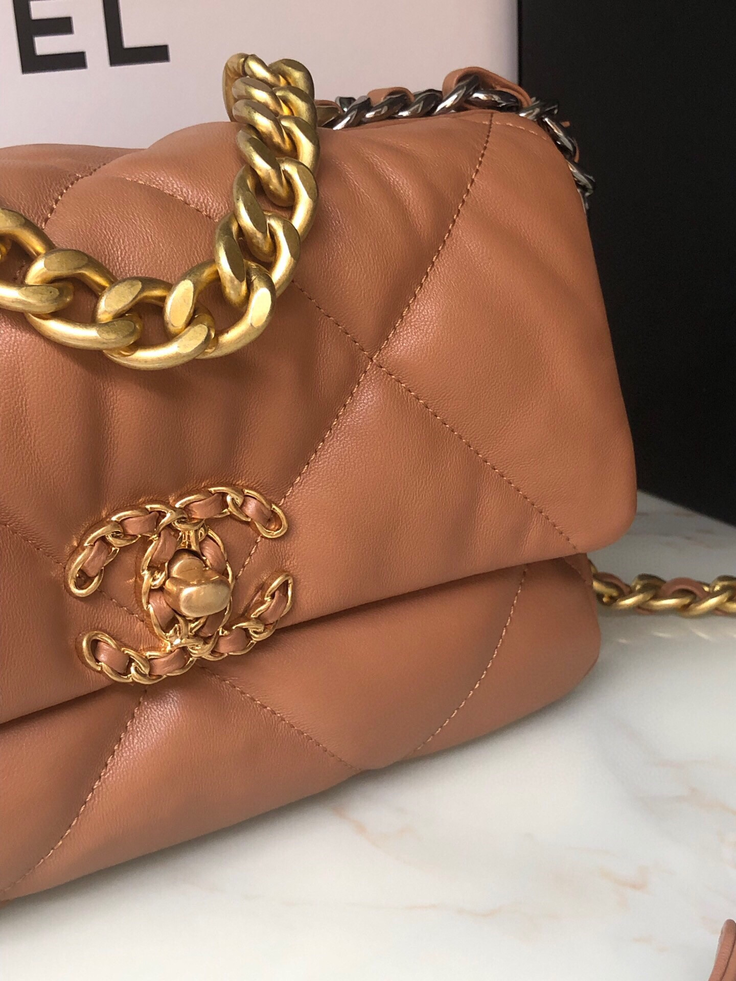 Ch*el 19 handbag shiny leather, gold-tone, silver-tone & ruthenium-finish metal caramel 6.2 × 10.1 × 3.5 in
