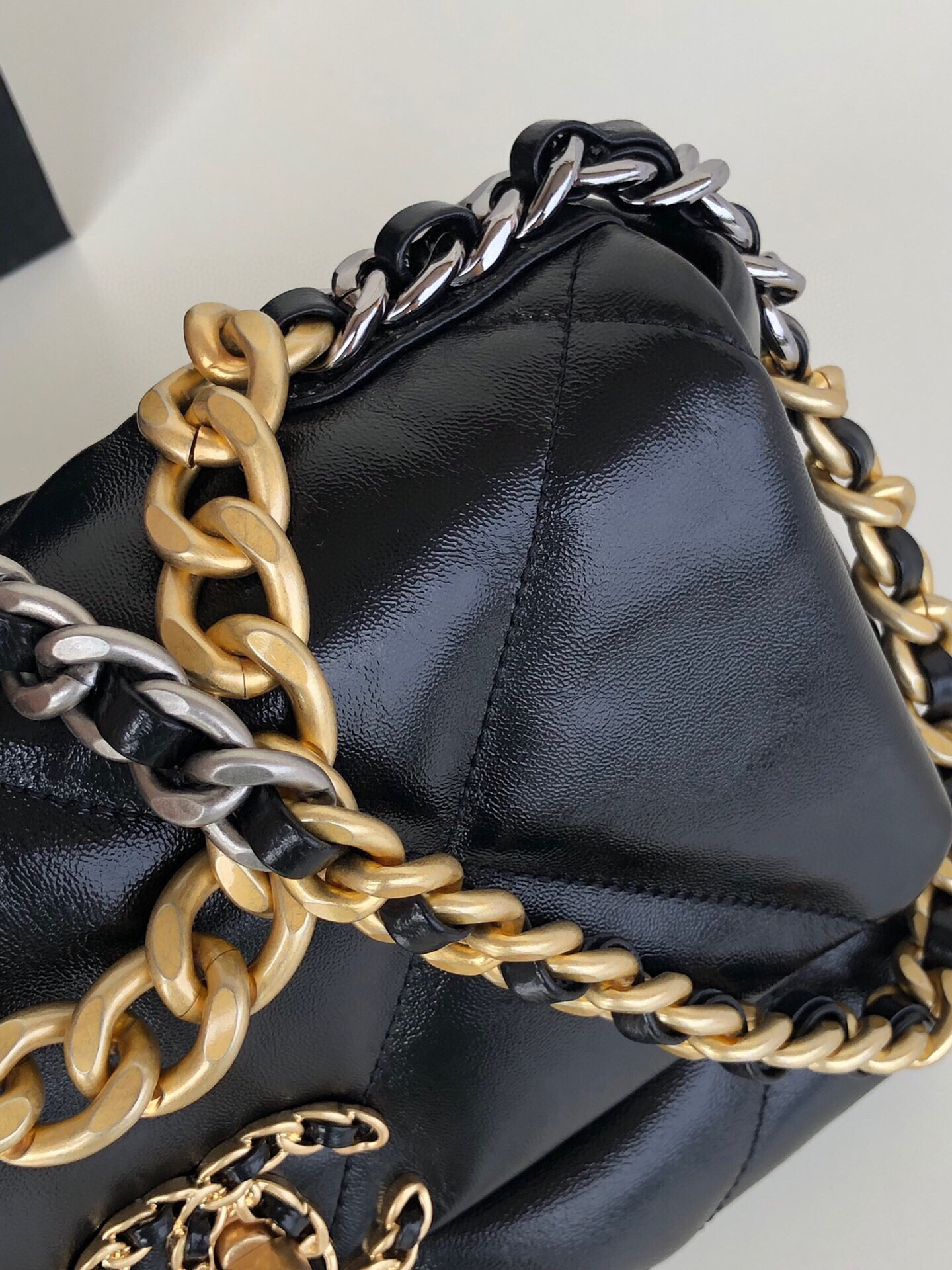 Ch*el 19 handbag shiny leather, gold-tone, silver-tone & ruthenium-finish metal black 6.2 × 10.1 × 3.5 in