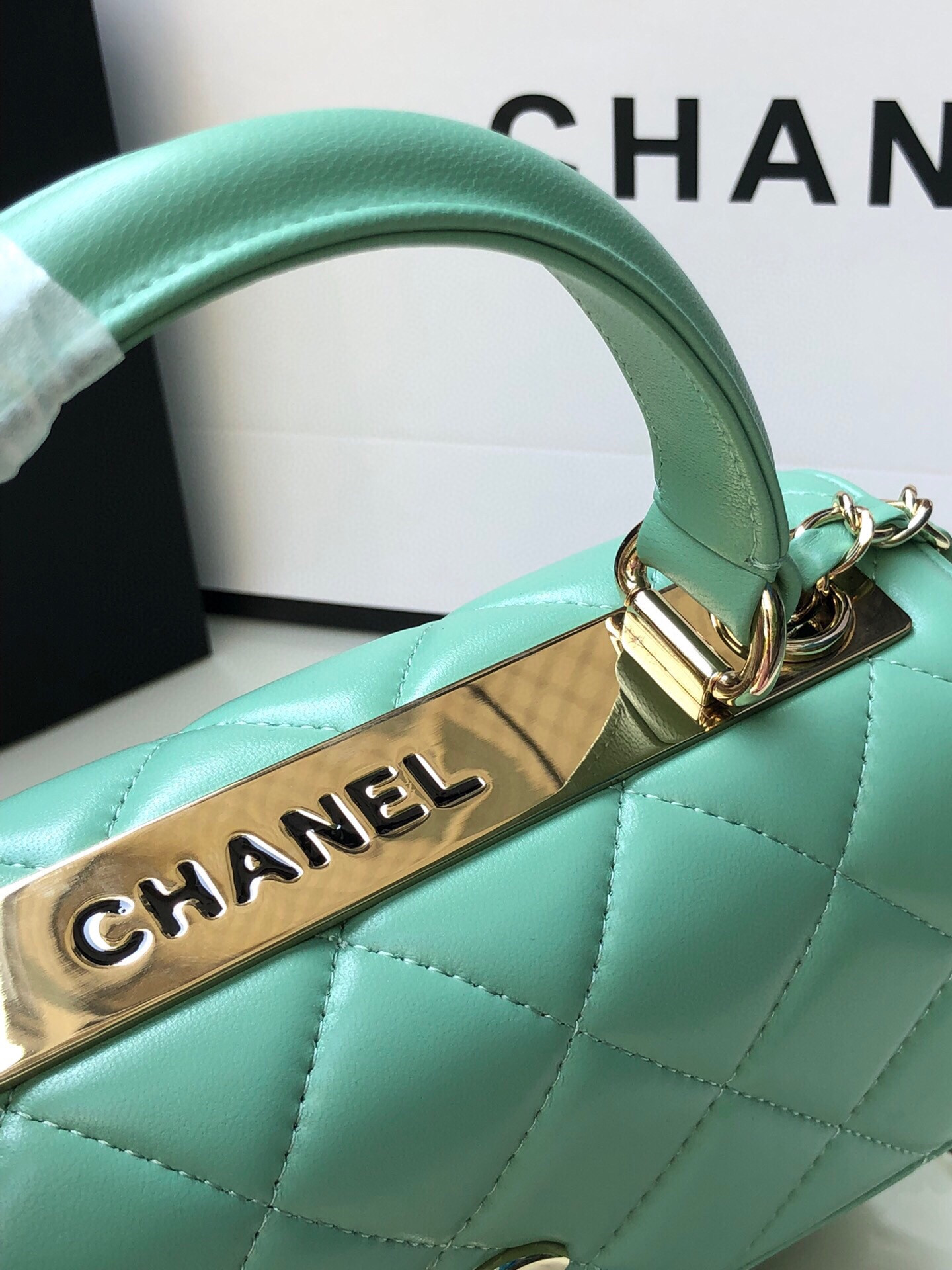 Ch*el flap bag with top handle 6.6 × 9.8 × 4.7 in