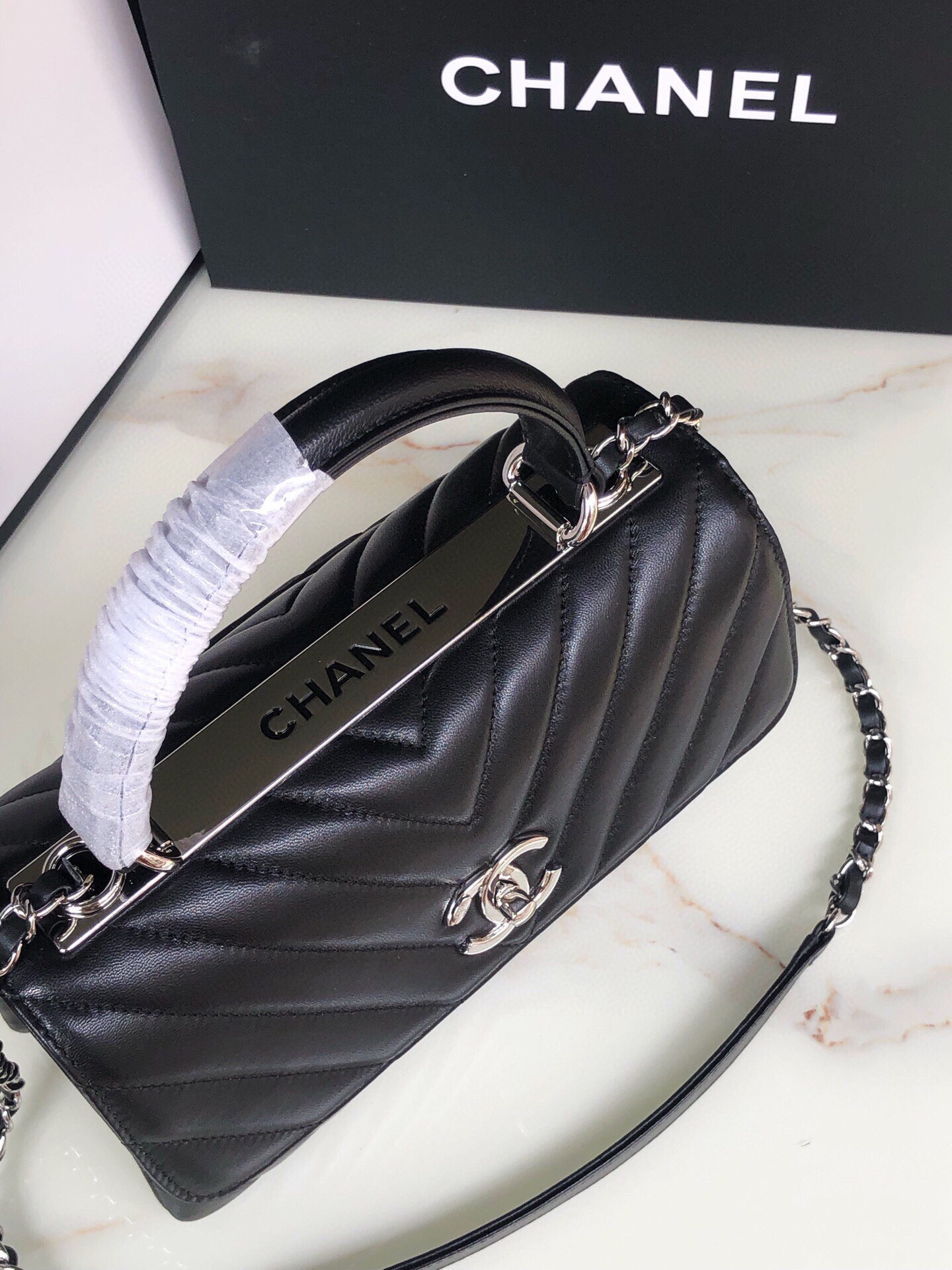 Ch*el flap bag with top handle 6.6 × 9.8 × 4.7 in