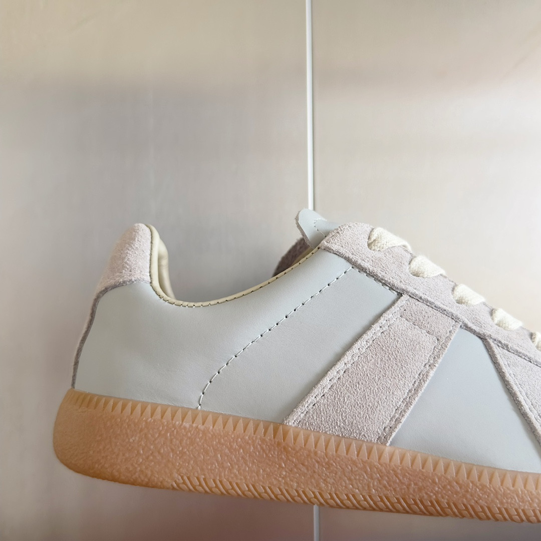 ua ma*s*n Ma*i*la mm6 sneakers